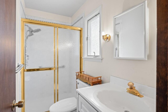 137 N Clark Dr, Palatine, IL 60074 - bathroom featuring a shower stall, toilet, and vanity
