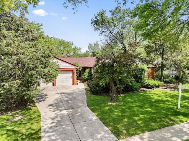 137 N Clark Dr, Palatine, IL 60074 - view of front facade with a garage, concrete driveway, a front lawn, and a chimney
