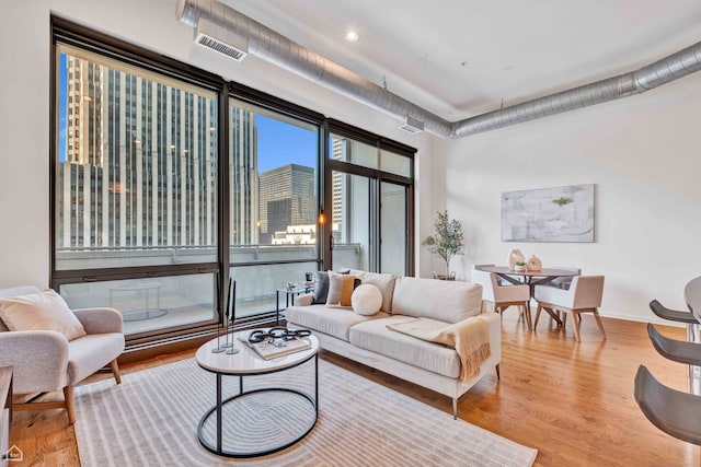 240 E Illinois St Unit 805, Chicago, IL 60611 - living room with wood finished floors and recessed lighting