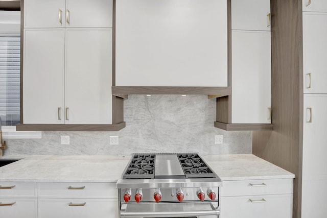 2353 W Ohio St, Chicago, IL 60612 - kitchen with high end stove, white cabinets, backsplash, and light stone counters