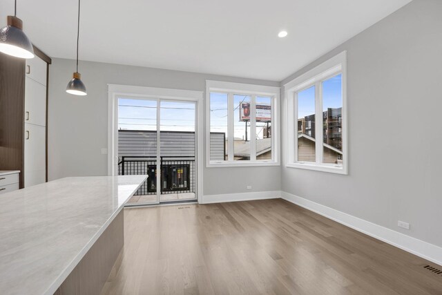 2353 W Ohio St, Chicago, IL 60612 - unfurnished living room featuring light wood-style flooring, baseboards, and recessed lighting