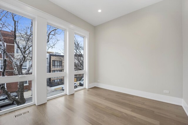 2353 W Ohio St, Chicago, IL 60612 - unfurnished room with wood finished floors, baseboards, and recessed lighting