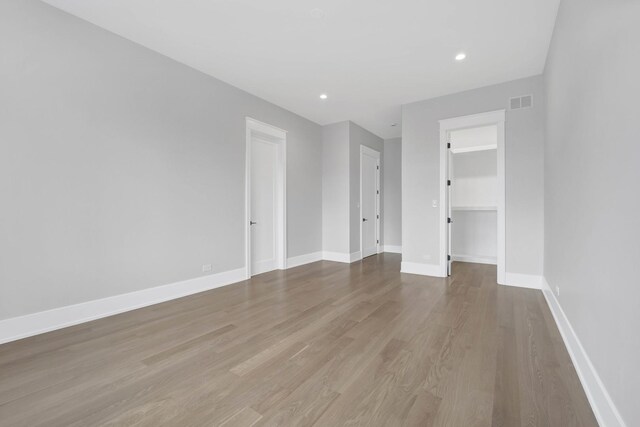 2353 W Ohio St, Chicago, IL 60612 - empty room featuring wood finished floors, baseboards, and recessed lighting