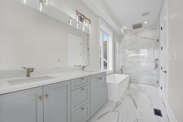 2353 W Ohio St, Chicago, IL 60612 - full bath featuring a marble finish shower, marble finish flooring, a freestanding tub, double vanity, and recessed lighting