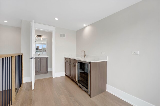 2353 W Ohio St, Chicago, IL 60612 - indoor wet bar with wine cooler, light wood-type flooring, baseboards, and recessed lighting