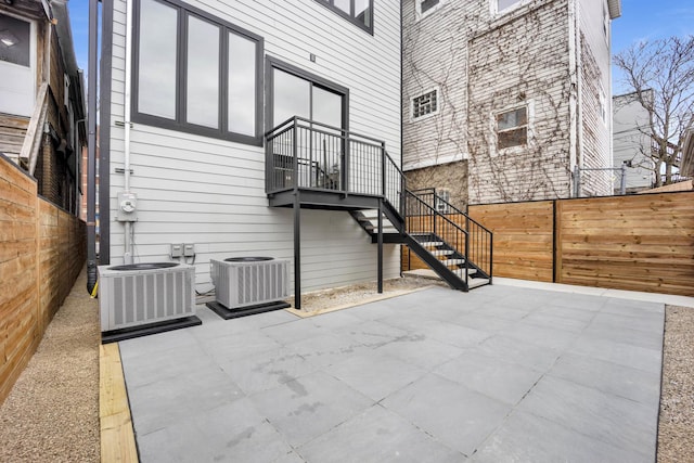 2353 W Ohio St, Chicago, IL 60612 - fenced backyard featuring central AC unit, stairs, and a patio