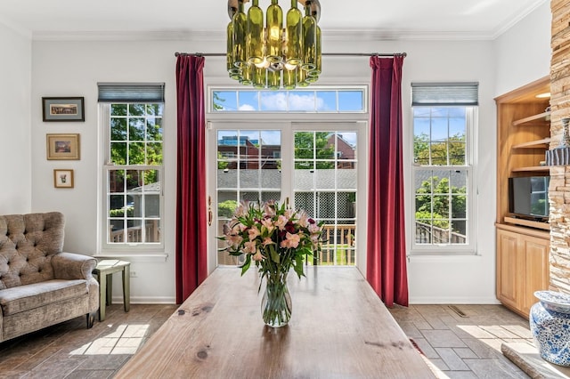 1448 N Mohawk St, Chicago, IL 60610 - dining area featuring a chandelier, baseboards, healthy amount of natural light, and ornamental molding