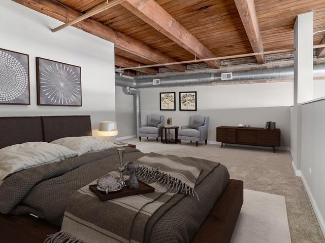 50 E 26th St Unit 406, Chicago, IL 60616 - carpeted bedroom featuring wooden ceiling with exposed beams and baseboards