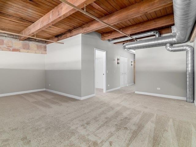 50 E 26th St Unit 406, Chicago, IL 60616 - below grade area with wood ceiling, carpet, and baseboards