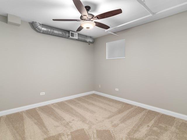 50 E 26th St Unit 406, Chicago, IL 60616 - carpeted empty room with ceiling fan and baseboards