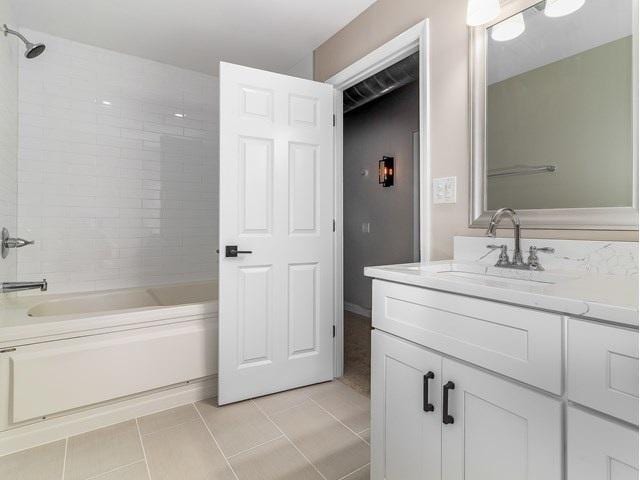 50 E 26th St Unit 406, Chicago, IL 60616 - bathroom with vanity, shower / bathtub combination, and tile patterned floors