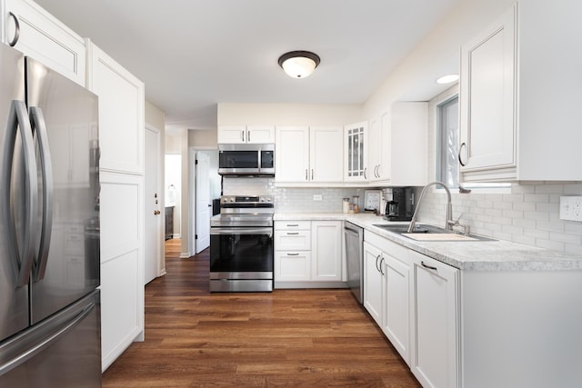 206-208 N Fremont St, Naperville, IL 60540 - kitchen with appliances with stainless steel finishes, a sink, white cabinetry, tasteful backsplash, and light countertops