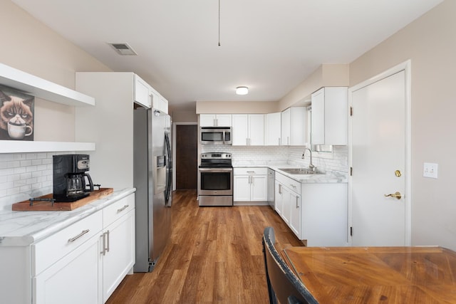 206-208 N Fremont St, Naperville, IL 60540 - kitchen with stainless steel appliances, a sink, decorative backsplash, and wood finished floors