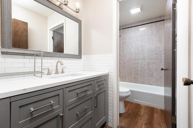 206-208 N Fremont St, Naperville, IL 60540 - full bath featuring toilet, vanity, wood finished floors, tub / shower combination, and backsplash