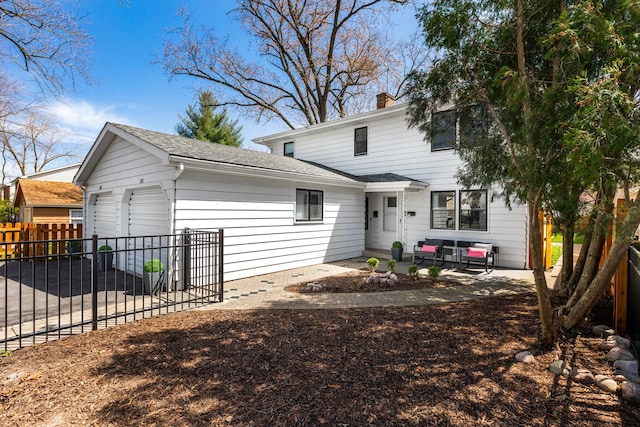206-208 N Fremont St, Naperville, IL 60540 - view of front of property featuring a chimney, roof with shingles, a patio area, and a garage
