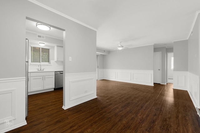 6724 181st St Unit 1513, Tinley Park, IL 60477 - unfurnished living room with ceiling fan, ornamental molding, wainscoting, a sink, and a decorative wall