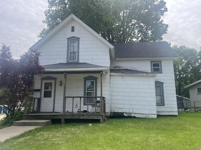 601 15th Ave, Sterling, IL 61081 - view of front facade featuring a porch, a front yard, and a shingled roof