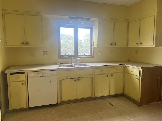 601 15th Ave, Sterling, IL 61081 - kitchen featuring dishwasher, a sink, light countertops, and cream cabinets