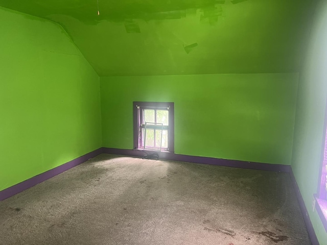 601 15th Ave, Sterling, IL 61081 - bonus room with carpet floors, lofted ceiling, and baseboards