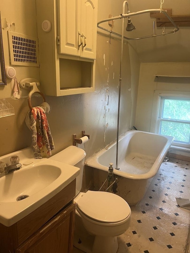 601 15th Ave, Sterling, IL 61081 - bathroom featuring vanity, tile patterned floors, toilet, and shower / bathtub combination