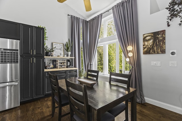 1475 Beaumont Cir, Bartlett, IL 60103 - dining area featuring lofted ceiling, healthy amount of natural light, dark wood-style floors, baseboards, and a ceiling fan