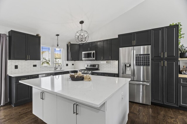 1475 Beaumont Cir, Bartlett, IL 60103 - kitchen with appliances with stainless steel finishes, a sink, a chandelier, and dark wood-style floors