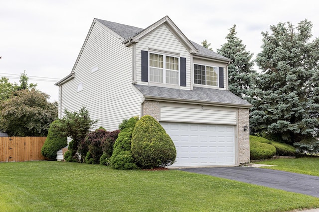 15 Brittany Ct, South Elgin, IL 60177 - view of front facade featuring asphalt driveway, a garage, a shingled roof, and brick siding