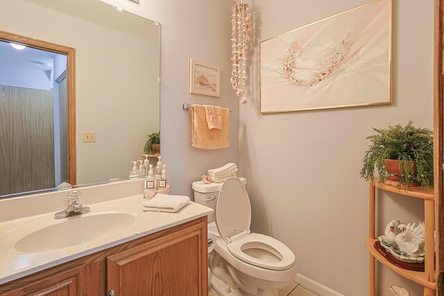 15 Brittany Ct, South Elgin, IL 60177 - half bathroom featuring vanity, toilet, tile patterned floors, and baseboards