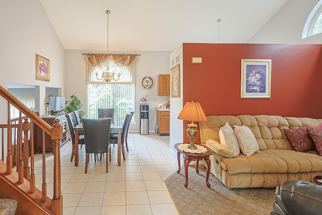 15 Brittany Ct, South Elgin, IL 60177 - living room featuring a chandelier, light tile patterned floors, stairs, and high vaulted ceiling