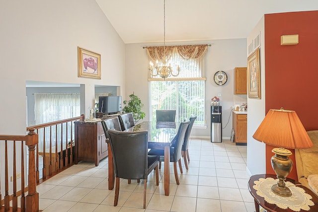 15 Brittany Ct, South Elgin, IL 60177 - dining area featuring a chandelier, light tile patterned floors, plenty of natural light, and high vaulted ceiling