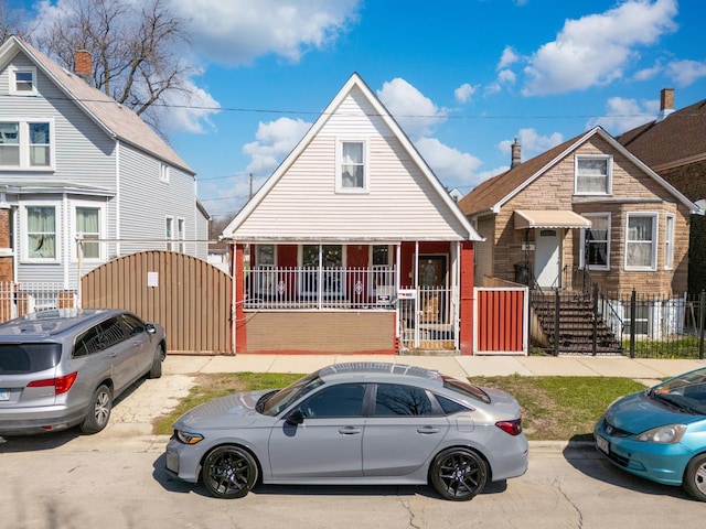 2248 W 50th Pl, Chicago, IL 60609 - bungalow-style home with a gate and brick siding