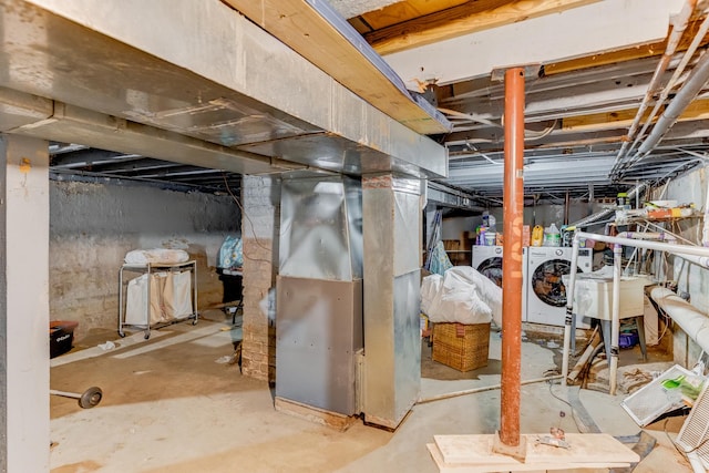 2248 W 50th Pl, Chicago, IL 60609 - unfinished basement with washer and dryer, heating unit, and a sink
