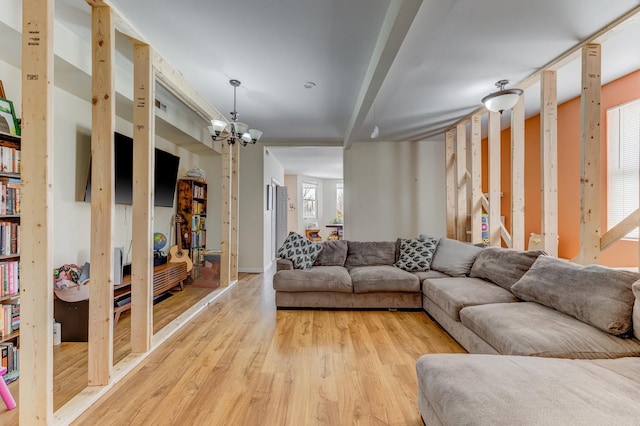 2248 W 50th Pl, Chicago, IL 60609 - living room featuring a chandelier and light wood-style flooring