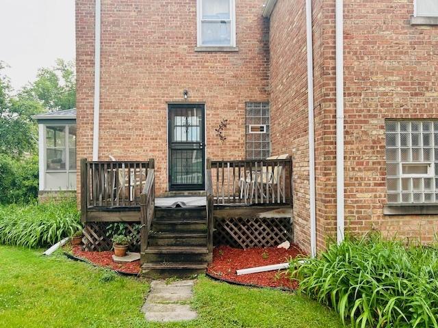 1607 183rd St, Homewood, IL 60430 - entrance to property featuring brick siding and a deck