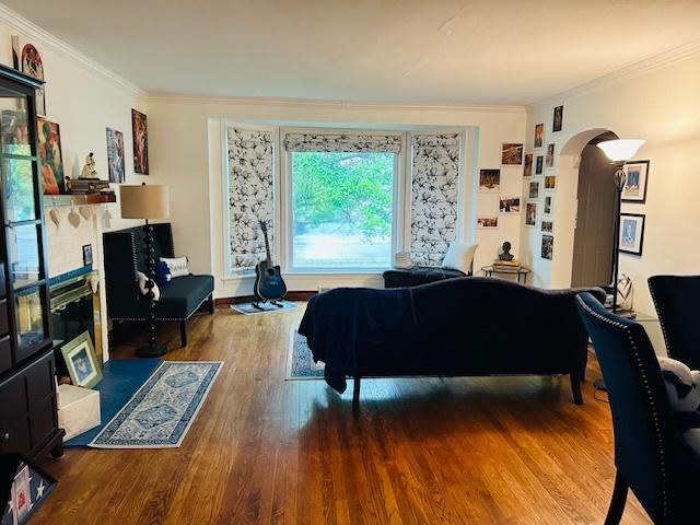 1607 183rd St, Homewood, IL 60430 - living room with crown molding, wood finished floors, and arched walkways