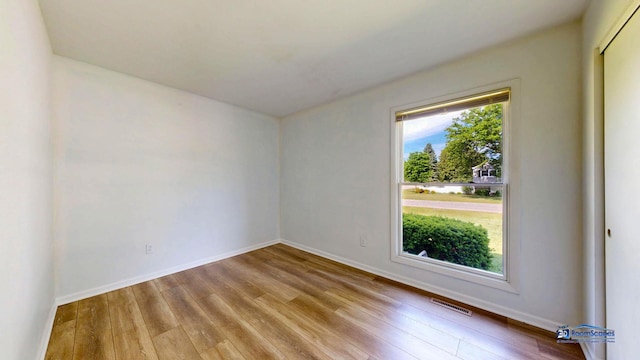 1510 Hillside Ln, Mchenry, IL 60051 - spare room featuring wood finished floors and baseboards
