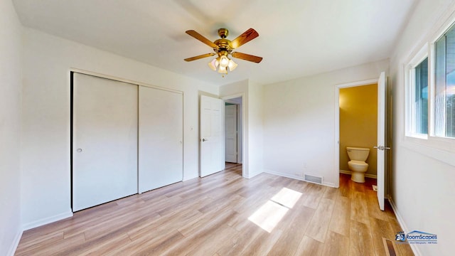 1510 Hillside Ln, Mchenry, IL 60051 - unfurnished bedroom with a closet, light wood-type flooring, baseboards, ensuite bathroom, and ceiling fan