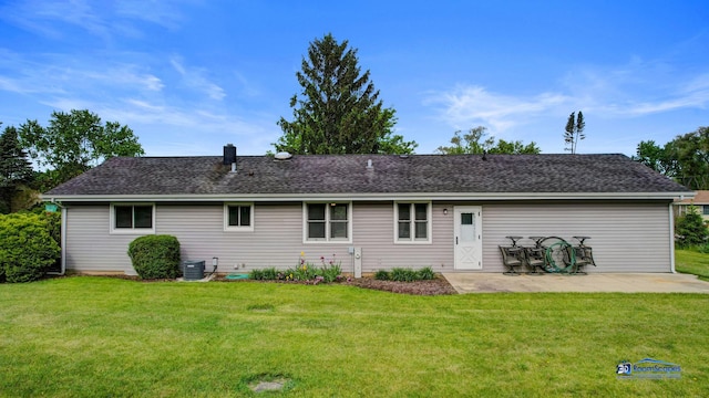 1510 Hillside Ln, Mchenry, IL 60051 - rear view of house featuring a patio, a lawn, central AC, and roof with shingles