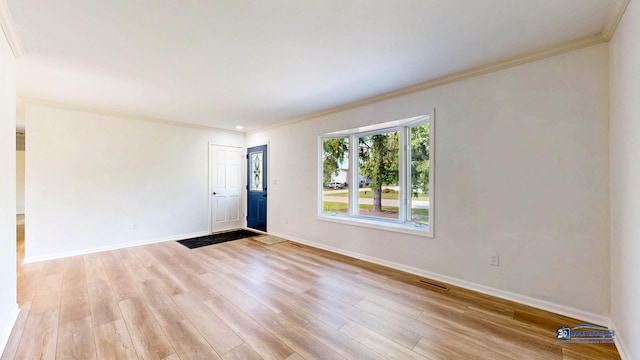 1510 Hillside Ln, Mchenry, IL 60051 - spare room with crown molding, baseboards, and light wood finished floors