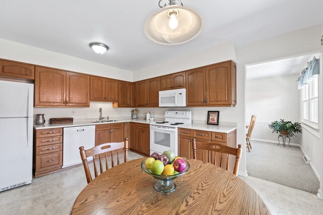 1805 E Tano Ln, Mount Prospect, IL 60056 - kitchen featuring white appliances, a sink, light countertops, and brown cabinets