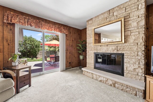 1805 E Tano Ln, Mount Prospect, IL 60056 - carpeted living room with a stone fireplace and wood walls