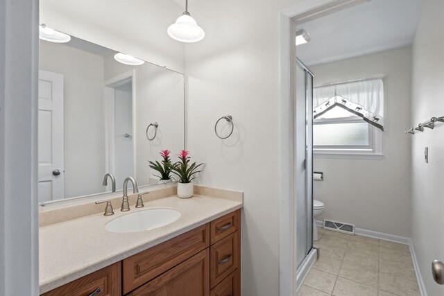 1805 E Tano Ln, Mount Prospect, IL 60056 - full bathroom with vanity, a shower stall, tile patterned flooring, and toilet