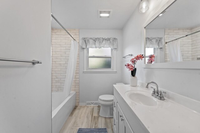 1805 E Tano Ln, Mount Prospect, IL 60056 - full bathroom featuring vanity, toilet, shower / tub combo with curtain, and wood finished floors