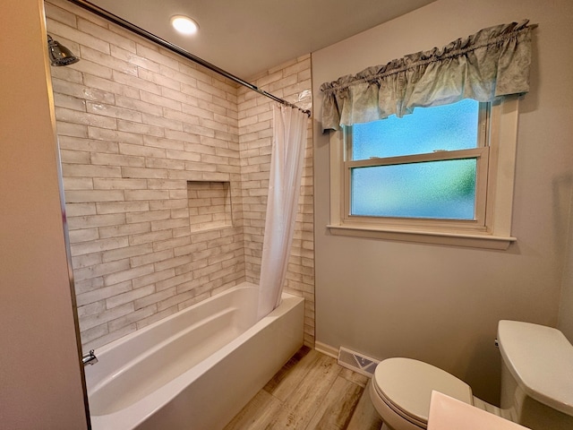 1805 E Tano Ln, Mount Prospect, IL 60056 - bathroom featuring toilet, wood finished floors, and shower / bath combo with shower curtain