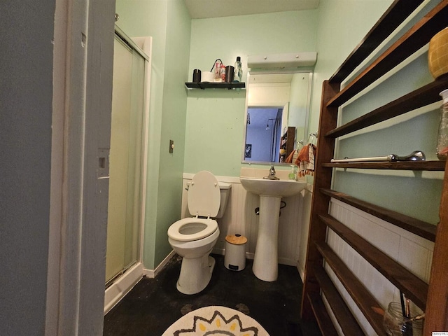 612 Edgewood Dr, Quincy, IL 62301 - bathroom featuring toilet, a shower stall, and a sink