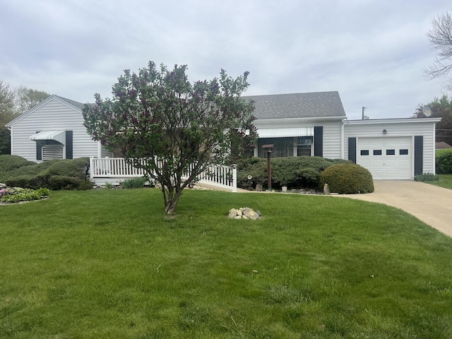 204 Elm St, Morrison, IL 61270 - view of front of property featuring an attached garage, driveway, a front lawn, and a shingled roof