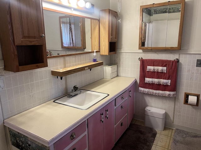 204 Elm St, Morrison, IL 61270 - bathroom featuring vanity, tile walls, a wainscoted wall, and toilet