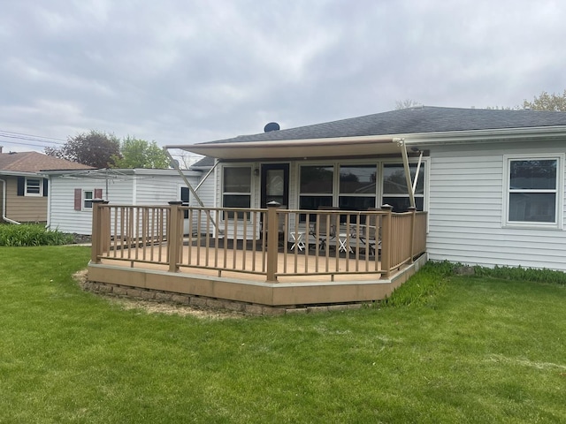 204 Elm St, Morrison, IL 61270 - back of house with roof with shingles, a deck, and a yard