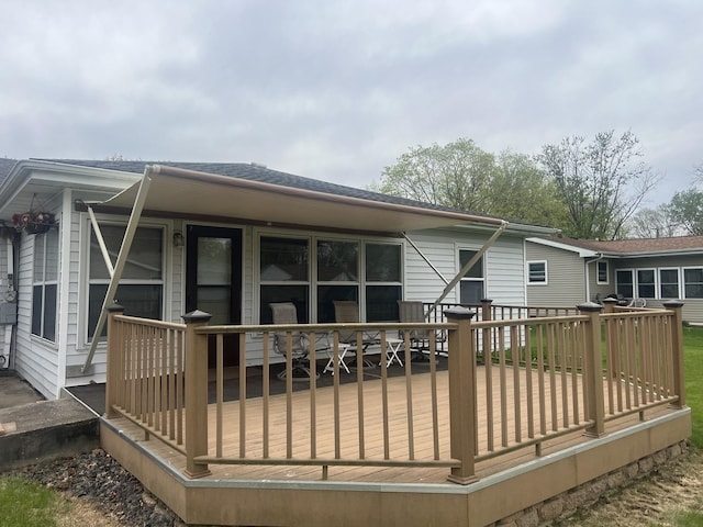 204 Elm St, Morrison, IL 61270 - back of property with a deck and roof with shingles