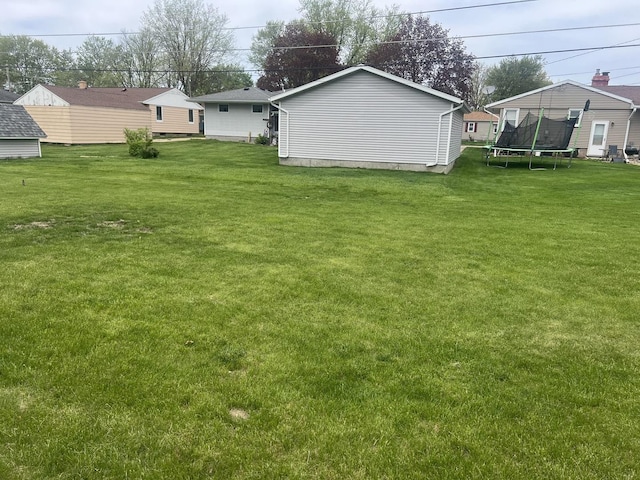 204 Elm St, Morrison, IL 61270 - view of green lawn with a trampoline